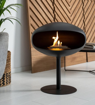 Cocoon Pedestal Bio Ethanol Fire - Black Shell, Black Stand - shown in a modern style living room
