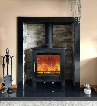 Woodford Turing 5X Multifuel Stove installed with a staggered slate chamber, granite slips and a granite hearth